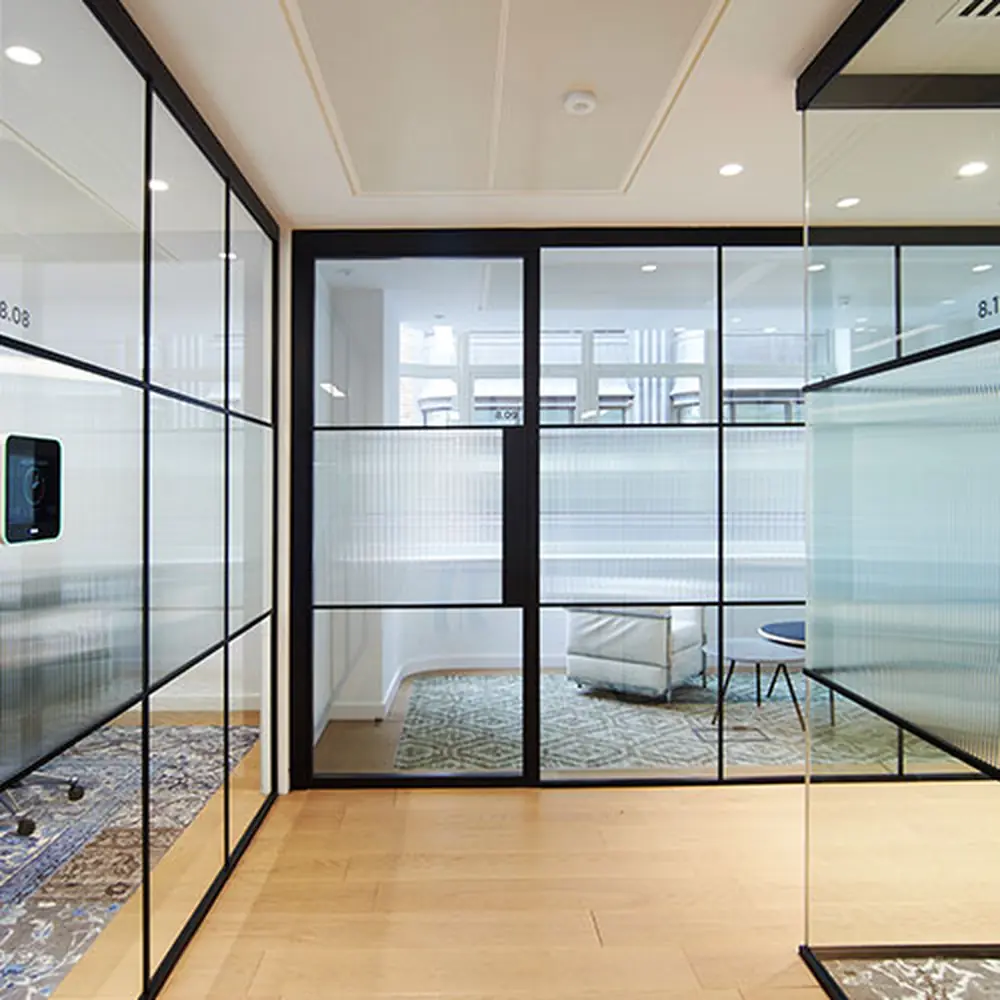 Commercial glass partition installation with safety markers during fit-out, Dubai