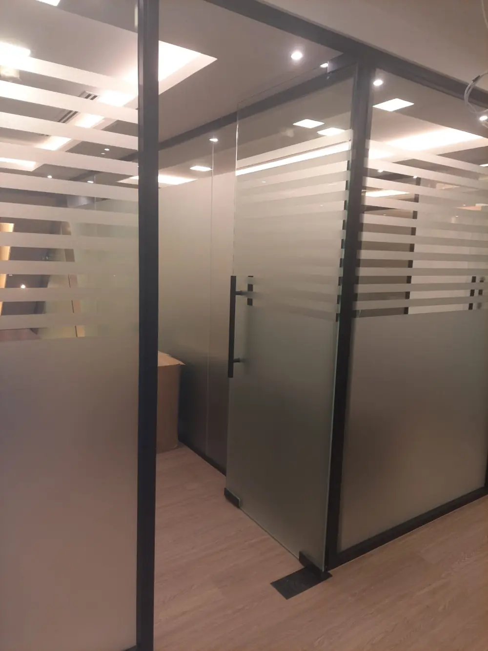 Frosted glass office partition door detail, Dubai commercial fit-out